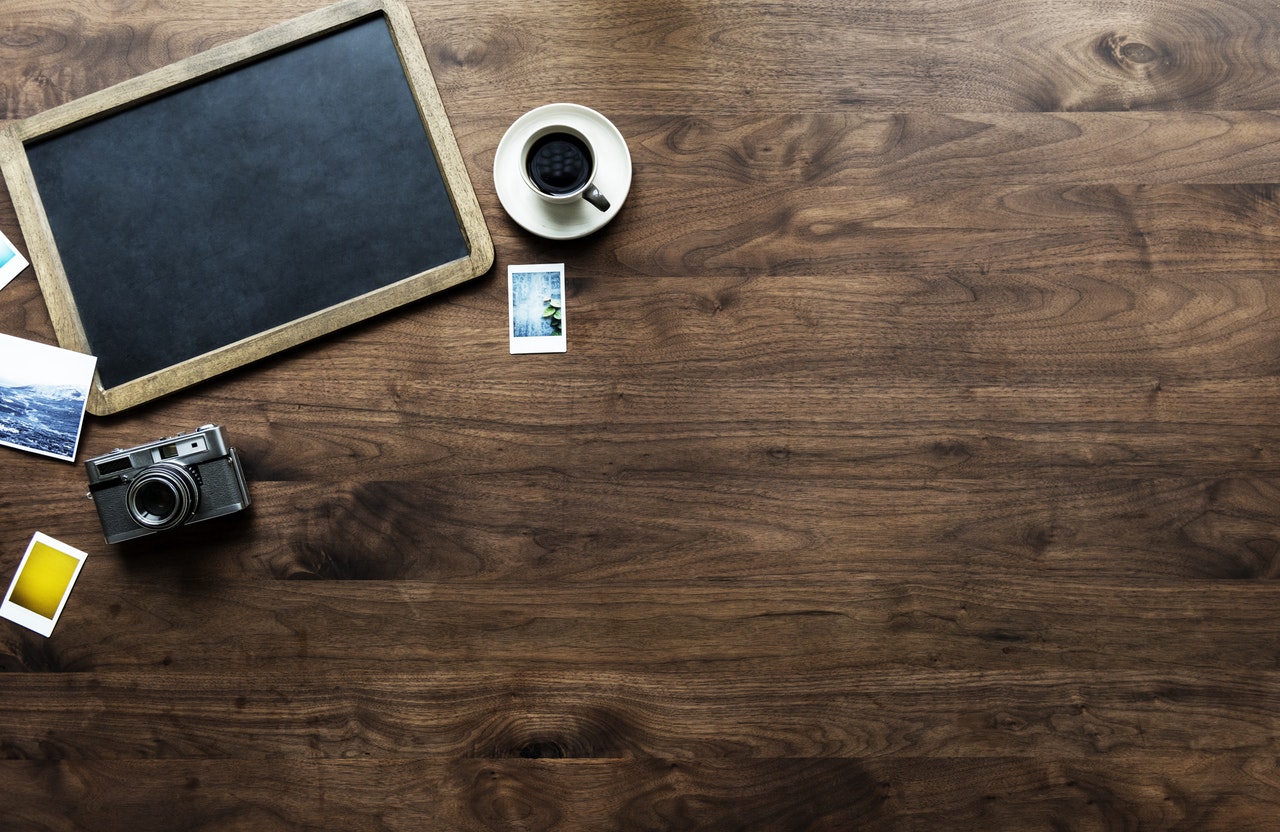  Main image which contains board, coffee mug, pen and paper.